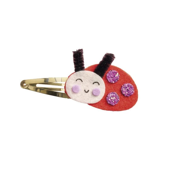 Set zum Basteln von floralen Haarspangen mit Gartenmotiven, ideal für Kinder.