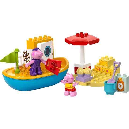 Peppa Pig und ihr LEGO® DUPLO® Boot am Strand mit einer Sandburg