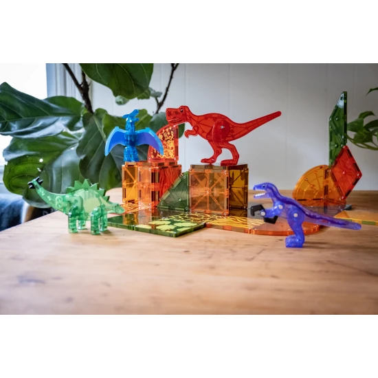 Magnetisches Dino-Bauset mit Dinosauriern und bunten Teilen.